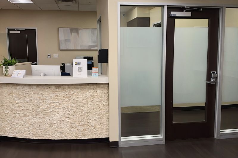 The reception counter at our Plano office, beside the door to the exam rooms.